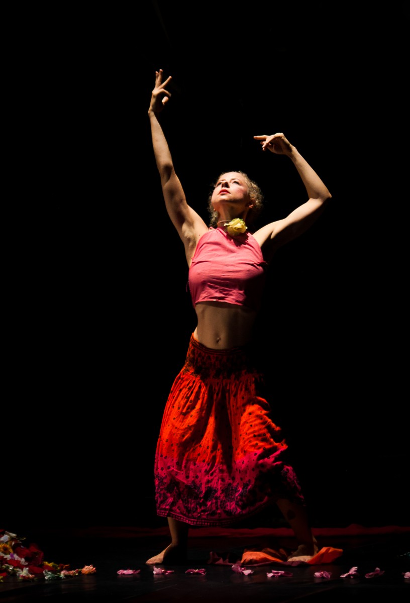Dancer and choreographer Valerie Green performs through 100s of silk flowers